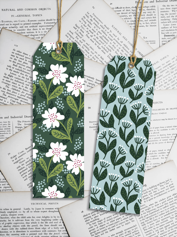 A free set of seven mockups showing a slim bookmark in various situations. Free Bookmarks Mockup